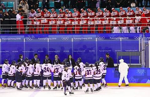 North Korean cheerleaders hold the Unified Korea flag as the team play during Pyeongchang Games (File | AFP)