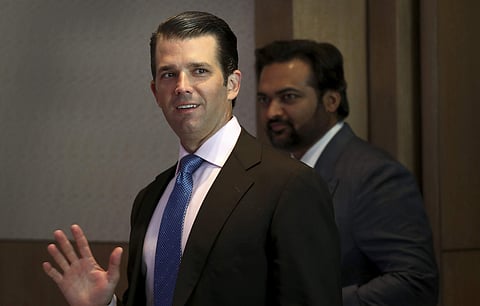 Donald Trump Jr. waves to media as he arrives for a meeting in New Delhi, India, Tuesday, Feb. 20, 2018. | AP