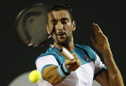 Croatia's Marin Cilic returns the ball to Argentina's Carlos Berlocq during the Rio Open tennis tournament. | AP