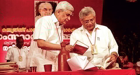 Prakash Karat and Sitaram Yechury check a book which got published on Thursday during the inaugural function of the CPM state meet in Thrissur | RAMEES M A