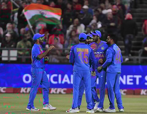 Indian cricketers celebrate a wicket during the third and final T20 cricket match between South Africa and India in Cape Town. | AP