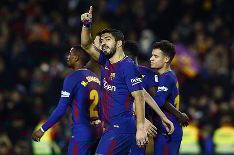 FC Barcelona's Luis Suarez celebrates after scoring during the Spanish La Liga soccer match between FC Barcelona and Girona at the Camp Nou stadium in Barcelona, Spain, Saturday, Feb. 24, 2018. | AP