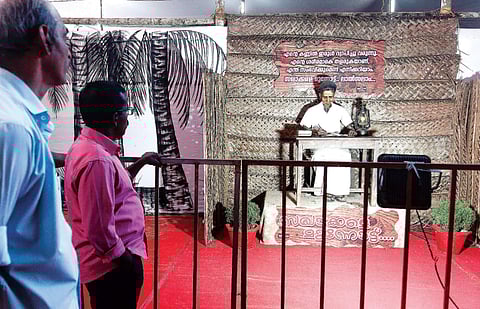 People go through an exhibition held as part of the CPM state conference in Thrissur on Saturday | RAMEES M A