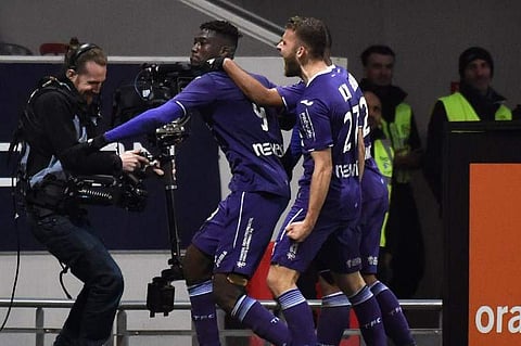 Toulouse forward Yaya Sanogo (L) celebrates after scoring a goal during the French L1 football match between Toulouse (TFC) and Monaco (ASM) on February 24. | AFP
