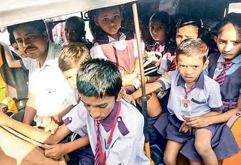 Students jostle for space inside the jam-packed autos; school bags dangle at the back of the vehicle | Express