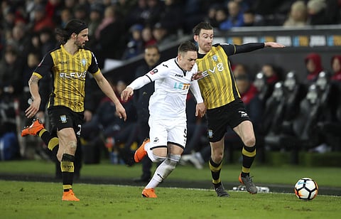 Swansea City's Connor Roberts and David Jones battle for the ball with George Boyd of Sheffield | AP