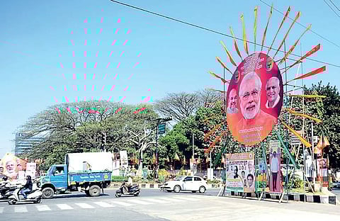 The city has been decked up with banners and hoardings on the eve of Prime Minister Narendra Modi’s mega rally at Palace Grounds on Sunday | NAGESH POLALI