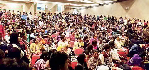 Indian workers seeking amnesty wait at the office of Indian Embassy in Kuwait on Sunday | Express photo