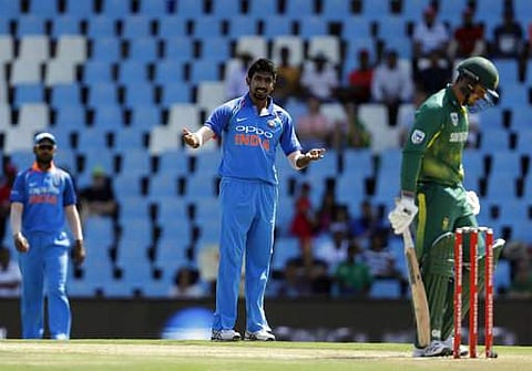 India's bowler Jasprit Bumrah, center, reacts after his delivery against South Africa's batsman Quinton de Kock‚ right, during the second One Day International. | AP