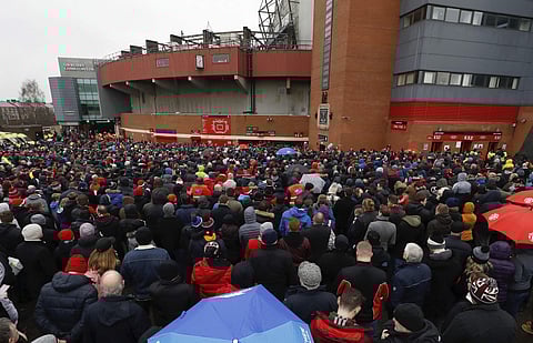 Soccer fans gather for a memorial to the Munich Air disaster at Old Trafford in Manchester, England, Saturday Feb. 3, 2018. | AP