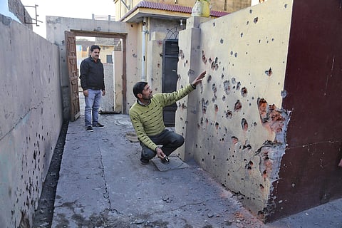 Villager shows a damaged section of his house after shelling from the Pakistani side on the India-Pakistan international border at Arnia Sector about 45km from Jammu. | PTI File Photo