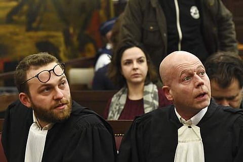 Belgian lawyer Sven Mary, right, and lawyer Romain Delcoigne, left, attend the trial of Salah Abdeslam at the Brussels Justice Palace in Brussels. | AP