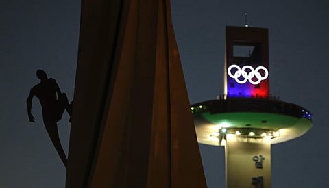 In pic: A human figure appears to be climbing an Olympic Cauldron at the Pyeongchang Olympic Plaza as preparations continue for the 2018 Winter Olympics in Pyeongchang, South Korea. (Photo | AP)
