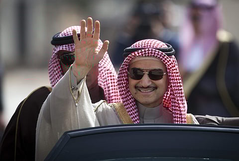 In this Feb. 4, 2014 file photo, Saudi billionaire Prince Alwaleed bin Talal, waves as he arrives at the headquarters of Palestinian President Mahmoud Abbas in the West Bank city of Ramallah. (Photo | Associated Press)
