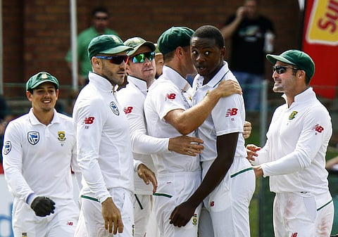 South Africa's bowler Kagiso Rabada, second right, with teammate celebrates after dismissing Australia's batsman Shaun Marsh, for 24 runs on the first day of the second cricket test match. | AP