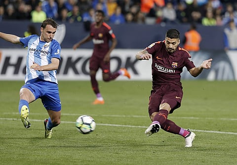 Luis Suarez and Philippe Coutinho put Barcelona two up inside half an hour at La Rosaleda Stadium | Photo: AP