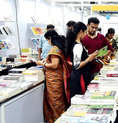Visitors going though books at the Krithi International Book Festival Albin Mathew
