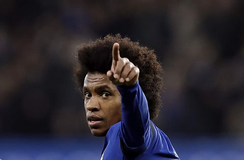 Chelsea striker Willian celebrates after scoring the opening goal during the English Premier League soccer match against Crystal Palace. | AP