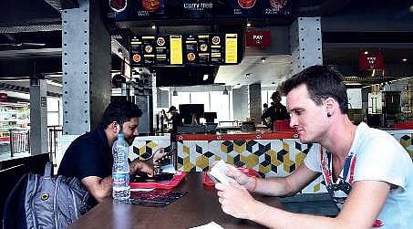 A customer inside the Food Stop Diner on platform number 1 at Ernakulam South Railway station.