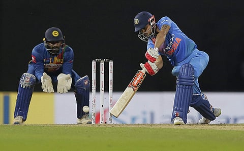 India's Manish Pandey plays a shot as Sri Lanka's Kusal Perera watches during their Twenty20 cricket match in Nidahas triangular series in Colombo Sri Lanka Monday March 12 2018. | AP