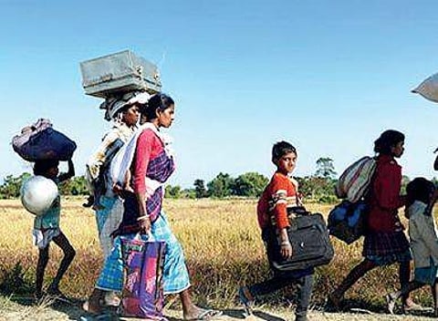 Some members of the Konda Reddy tribe seen migrating to safer places, in Bhadrachalam district on Monday | Express photo