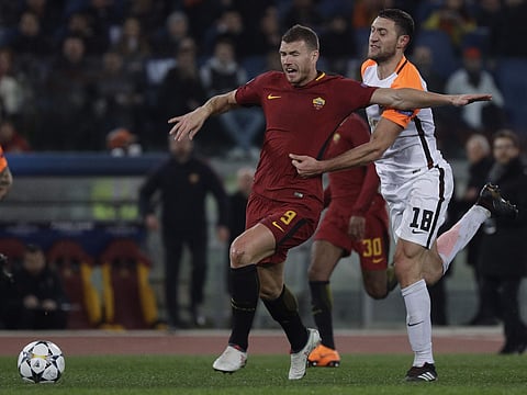 Roma's Edin Dzeko is fouled by Shakhtar's Ivan Ordets during a Champions League round of 16 second-leg soccer match between Roma and Shakhtar Donetsk, at the Rome Olympic stadium, Tuesday, March 13, 2018. | AP