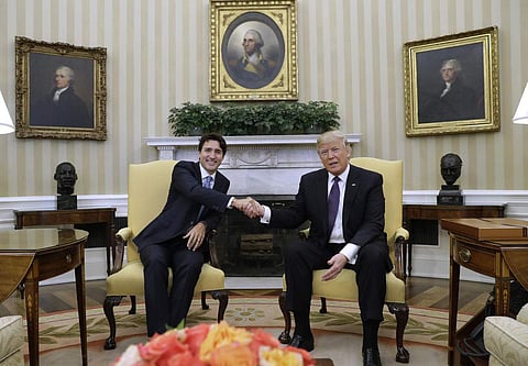 Canadian PM Justin Trudeau with US President Donald Trump (Photo | AP)