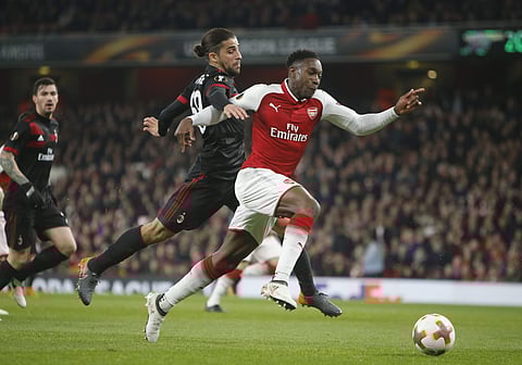 Arsenal's Danny Welbeck, right, challenges for the ball with AC Milan's Ricardo Rodriguez during the Europa League round of 16 second leg soccer match between Arsenal and AC Milan at the Emirates stadium in London, Thursday, March, 15, 2018. | AP