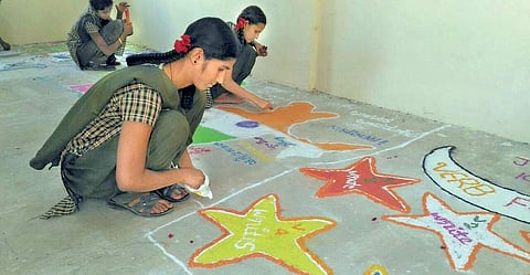 Students draw rangoli on different subjects at a government high school at Vijayanagar in Kalaburagi