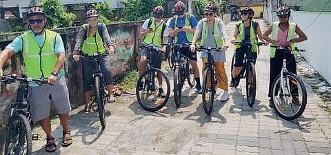Foreigners exploring West Kochi on bicycles