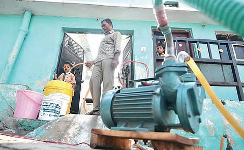 People fetching drinking water by using motor pumps due to less flow at Vattepally, near Falaknuma | R Satish babu