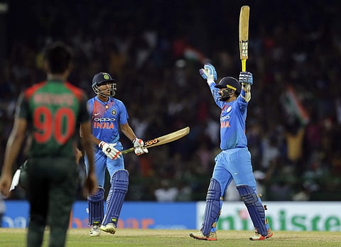 India's Dinesh Karthik, right, celebrates scoring the winning run to defeat Bangladesh by four wickets during the finals of Nidahas triangular Twenty20 cricket series in Colombo, Sri Lanka, Sunday, March 18, 2018. | Photo: AP