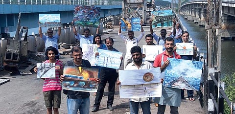 Artists protesting against the dismantling of the old Venduruthy rail bridge, which was constructed during the British rule in India, at Thevara on Sunday | Melton Antony