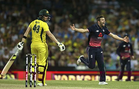 England's Mark Wood, right, celebrates taking the wicket of Australia's Steve Smith during their one day international cricket match in Sydney, Sunday, Jan. 21, 2018. | AP File Photo