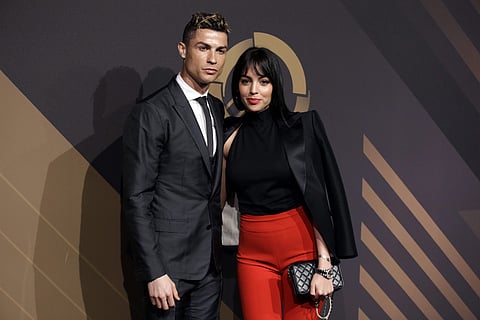 Real Madrid player Cristiano Ronaldo and his girlfriend Georgina Rodriguez pose for photos as they arrive for the Portuguese soccer federation awards ceremony. | AP