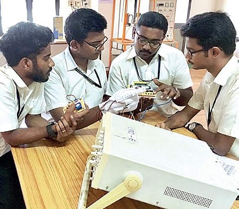 Students working on their smart glow device