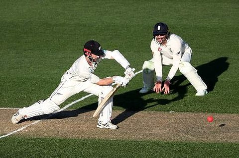 New Zealand's captain Kane Williamson (L) plays a shot during the first day of the day-night Test cricket match between New Zealand and England at Eden Park in Auckland on March 22, 2018. | AFP