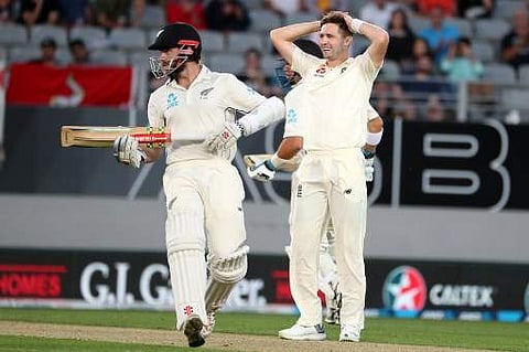 Bowler Chris Woakes of England reacts to a shot during the first day of the day-night Test cricket match between New Zealand and England at Eden Park in Auckland on March 22, 2018. | AFP