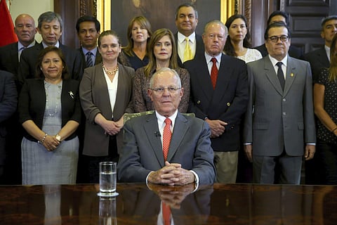 President Pedro Pablo Kuczynski poses with his cabinet before addressing the nation and announcing his resignation from office. | AP