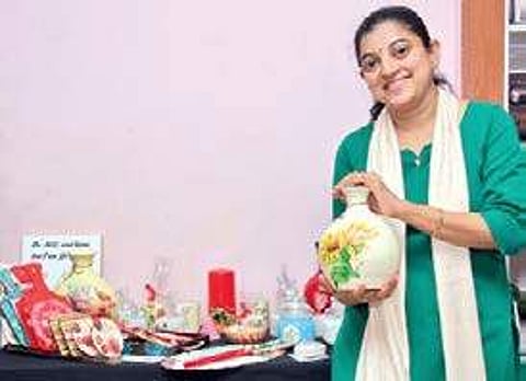 Veena Jacob does decoupage art on all manner of objects, from furniture to candles to soap B P Deepu