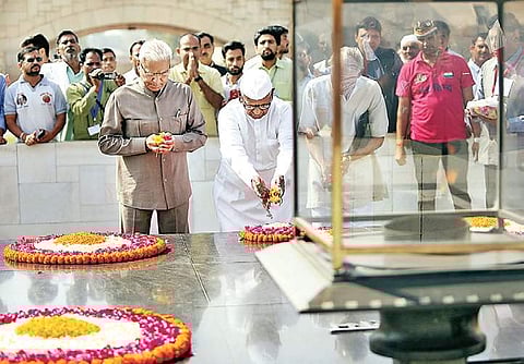 Social activist Anna Hazare pays tribute at Rajghat ahead of the start of an indefinite protest against the Central government, in New Delhi on Friday. | Parveen Negi