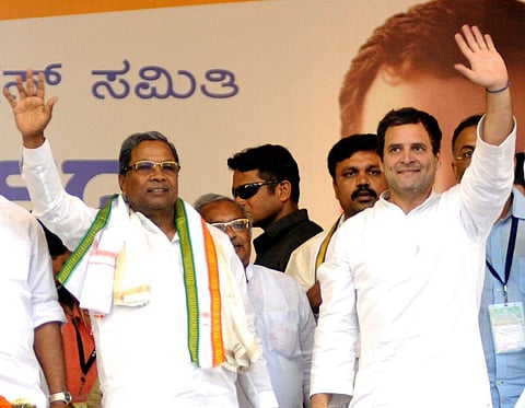 Congress president Rahul Gandhi and Karnataka Chief Minister Siddaramaiah attend a public meeting at Maharaja College Ground in Mysuru on Sunday. | (Udayshankar S | EPS)
