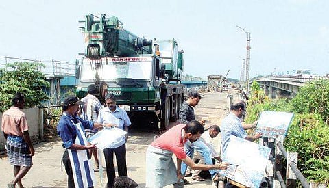 Artists painting the Venduruthy old railway bridge. They are protesting the dismantling of the bridge | Melton Antony