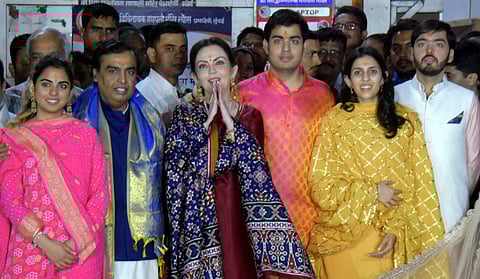 The Ambani family during their visit to Mumbai's Siddhivinayak Temple on Sunday after an engagement ceremony of billionaire Mukesh Ambani's eldest son Akash Ambani to Shloka Mehta in Goa. (PTI)