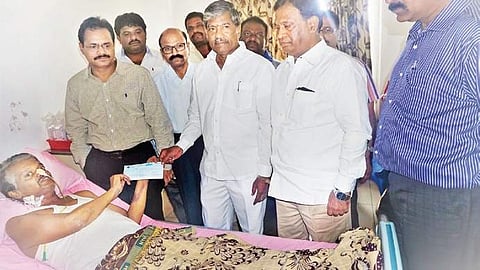 Coach Kishore was handed a cheque for `25 lakh by the government on Sunday