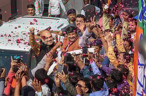 BJP party chief Amit Shah and Delhi unit chief Manoj Tiwari celebrate after BJP's victory in Tripura | PTI