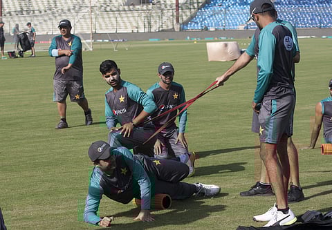 Pakistani cricket team players take part in a warm up session for the upcoming T20 series against West Indies in Karachi, Pakistan. | AP