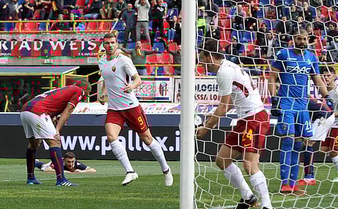 Roma's Edin Dzeko, center, reacts after scoring during the Serie A soccer match between Bologna and Roma at the Renato Dall'Ara stadium in Bologna, Italy, Saturday, March 31, 2018. | AP
