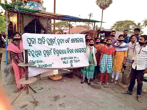 Women under the banner of Odisha Nisha Nibarana Abhiyan taking out a rally protesting illegal sale of liquor in Japa panchayat on Friday | Express
