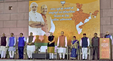 Prime Minister Narendra Modi with party leaders at a meeting after their victory in North-East Assembly election at party headquarters in New Delhi on Saturday. (PTI)
